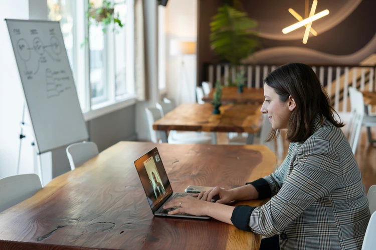 Lady sitting in front of a laptop